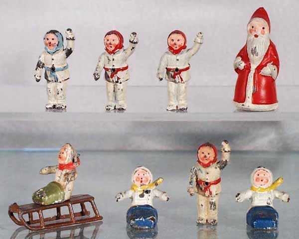 BRITAINS WINTER FIGURES: 8 pieces, Santa & 7 children in snow suits, 1 sled, some playwear, C4-6.