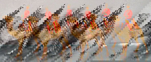 HEYDE CAMEL CORPS: 90mm, 6 mounted figures, 4 missing helmet spikes, some paint wear on striped blankets from rider's legs, C4-6.