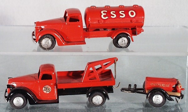 2 TEKNO FORD TRUCKS: 424 Esso Gas Truck, 2 tires flat, 428 Wrecker, 437 Fire Pumper Trailer, some die cast fatigue, hoses cracked, C7-8.
