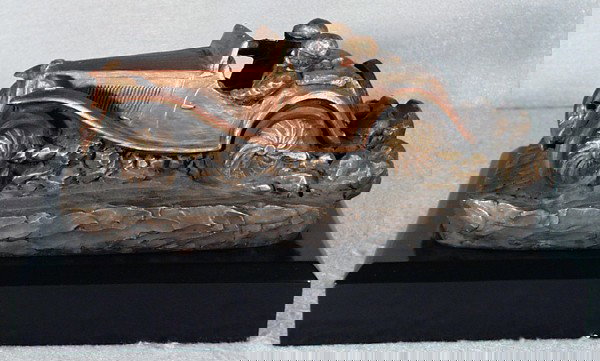 MG TC PLASTER SCULPTURE: signed by Boyles of Dallas, Texas, 13 1/2" long, mounted on wooden plinth, C8-9.