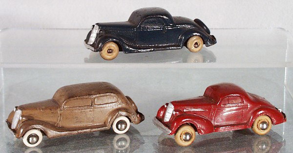 3 RUBBER AUTOS: Auburn 35 Ford, blue, Seiberling 35 Ford, brown, Rainbow Rubber 35 Ford, red, all have repainted silver trim, C4-5.
