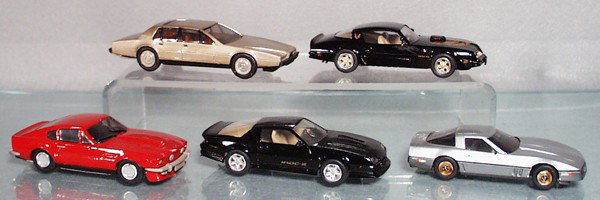 4 WESTERN MODELS: die cast, 1977 Aston Martin Lagonda, Pontiac Trans Am, 1983 Chevrolet Corvette, 1985 Camaro Iroc, Aston Martin V8, missing 2 mirrors, made in England, C8-9.