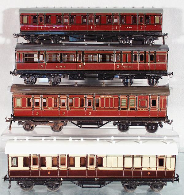 4 BING BASSETT-LOWKE COACHES: O ga, 3490 LMS coach, roof restored, 9343 LMS coach, 2783 Midland coach, 1921 Great Western coch, roof restored, all are 12 1/2" long, C5-6.