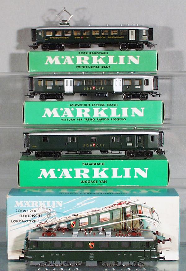 MARKLIN SWISS TRAIN SET: HO ga, 3050 electric loco, both decals have minor wear, w/unused decal sheet, w/passenger cars 4035, 4038, 4017, orig boxes minor wear, C8.