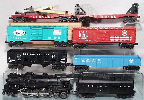 LIONEL TRAIN SET: O ga, 2037 loco, 234W tender, 6076 hopper, 6162 gondola, 6464-900 NYC box car, 6464-525 M&StL box car, 6660 boom crane car, oxidation on base, 6469 flat car, C5-7.