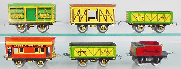 6 AMERICAN FLYER FREIGHT CARS: O ga, 535 stock car, 534 box car, 2 Hummer sand cars, 536 caboose, 119 tender, C7-8.