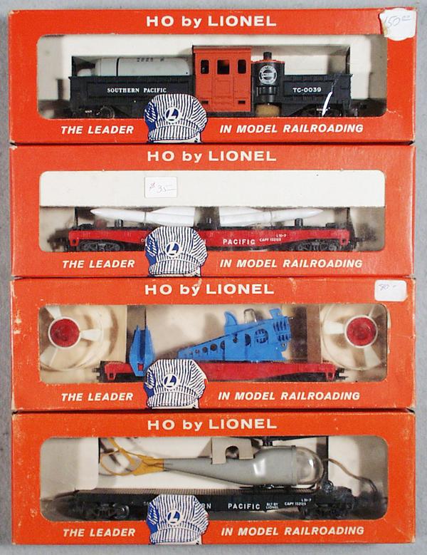 4 LIONEL FREIGHT CARS: HO ga, 0039 track cleaning car, 0823 missile carrying car, 0349 turbo missile car, 0806 helicopter flat, orig set box & insert minor wear, C8-9.