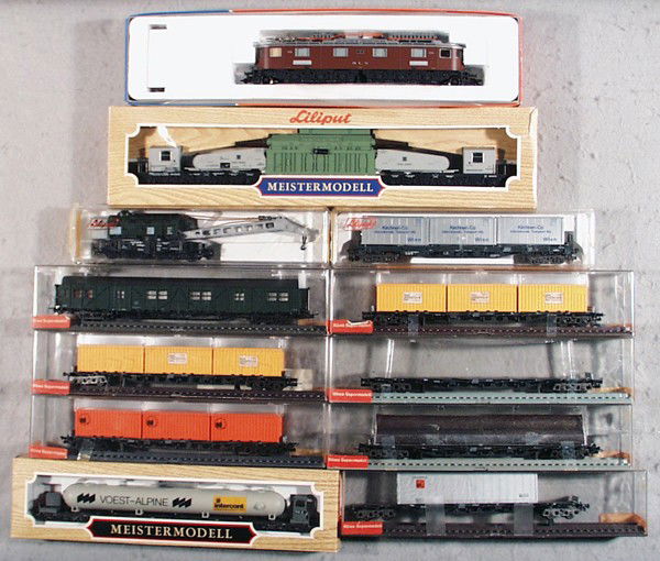 ROCO, ROWA & LILIPUT TRAIN SET: HO ga, 2-rail, Roco 43952 electric loco, w/4 Liliput freight cars 201C, 210, 209, 384, & 7 Rowa freight cars, orig boxes minor wear, C6-9.