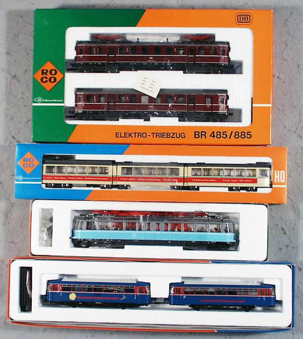 ROCO TRAIN LOT: HO ga, 14148A electric loco set, 3-rail, 43930 rail car, 3-rail, 69025 railbus set, 3-rail, 8504A tram car set, 2-rail, orig boxes, C9.