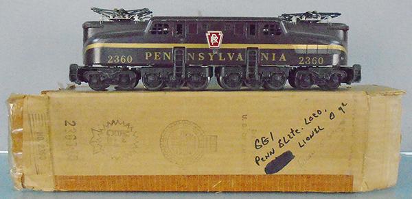 LIONEL 2360 PA GG1: O ga, tuscan, twin motors, lettering & numbers are heatstamped, stripe is rubberstamped, small wear spot under side decal on 1 side, orig box & insert worn, w/graffiti, C6-7.