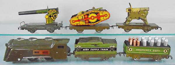 MARX ARMY TRAIN SET: O ga, 597 electric CV loco, 952 tender, 552 ordnance car w/repro shells & insert, 572AA Anti Aircraft gun, 5725T flat w/tank, windup not working, 572MG machine gun car, C5-6.