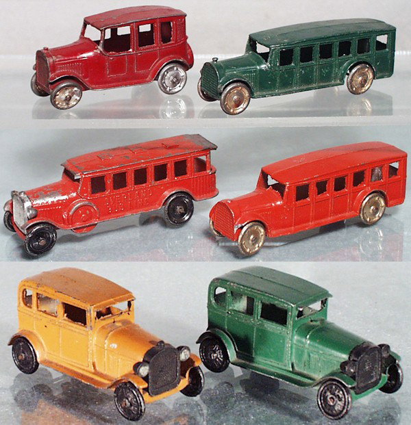 6 TOOTSIETOY VEHICLES: 4629 Taxi, 2 wheels replaced, 2 #4651 Fageol Buses, both have 1 broken fender tip, 4680 Overland Bus, 2 #6665 Ford Model A Sedans, C4-5.