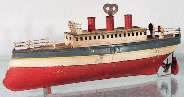 CARETTE BOAT: handpainted tin, clockwork working, missing front mast & rear flag, 11" long, C5-6.
