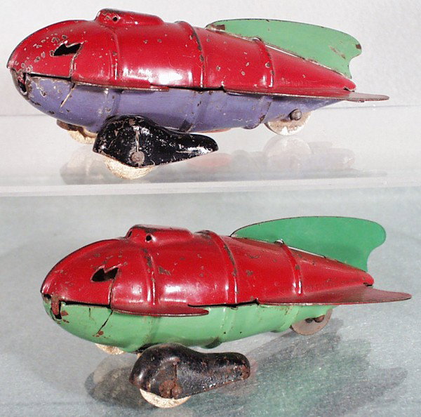 2 WYANDOTTE 319 ROCKET RACERS: painted pressed steel, white rubber tires, 1 has oxidation on 1 fender, both racers chipped, both 6 1/2" long, C4.