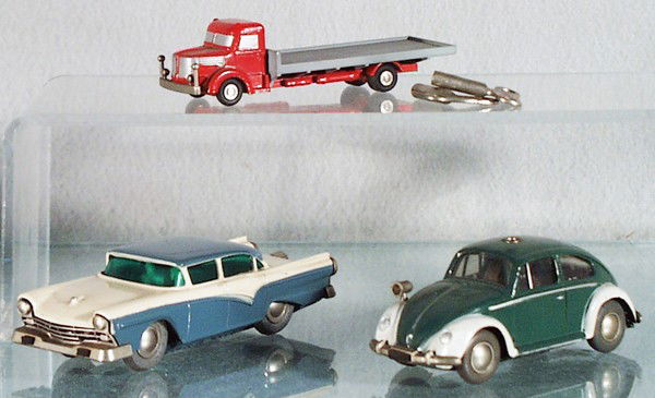 3 SCHUCO VEHICLES: 749 Krupp Truck Piccolo, 1045 Ford Micro Racer, 1046 VW Police Micro Racer, both are clockwork working, w/keys, VW missing roof light, orig issues, C5-7.