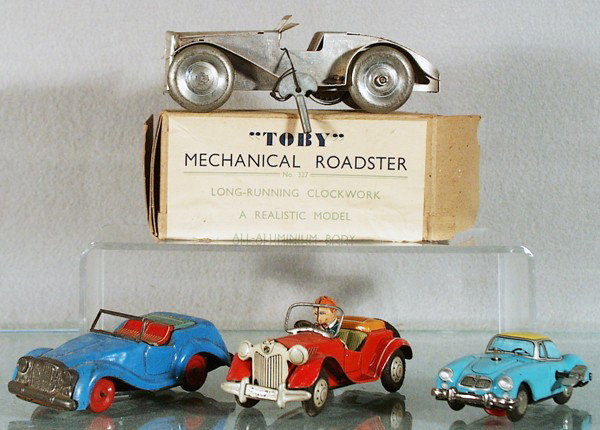 4 MG AUTOS: litho tin, 327 Toby Roadster, 6 1/4" long, clockwork working, orig box, Hadson MG, 5" long, friction working, Marx MG, friction not working, Y MGA, clockwork working, C5-8.