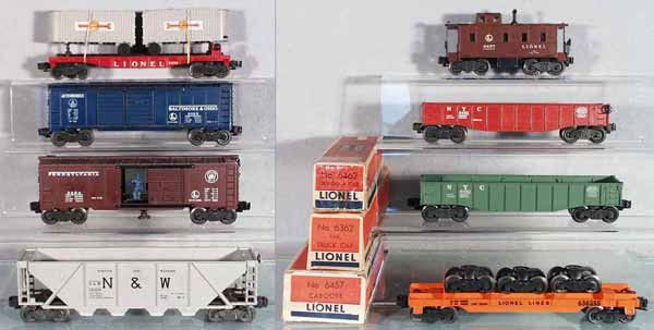 8 LIONEL FREIGHT CARS: O ga, 6430 flat w/vans, decals chipped, 6468 B&O auto box car, 4 steps chipped, 3484 operating PRR box car, 2 steps & roof edge chipped, 6446 N&W quadhopper, w/bubble wrap marks, 6457 caboose, paint c