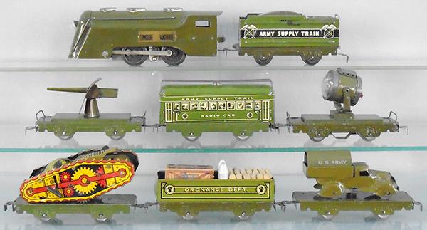 MARX ARMY SET: O ga, litho tin, 597 Commodore Vanderbilt, 952 Army tender, 572 field gun, 557M radio car, 561M searchlight, 572 ST flat w/sparkling tank, windup working, 552M ordinance gondola w/orig loads, 572M fla