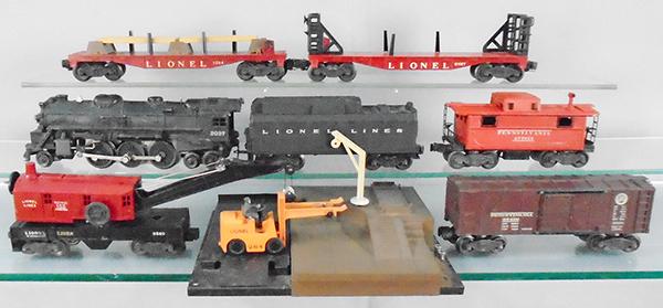 LIONEL TRAIN SET: O ga, 2037 loco w/smoke, 6026W tender, 6560 crane, 6454 PA box car, 6467 miscellaneous car, 264 lumber platform w/6264 lumber car, 2457 caboose, C5-7.