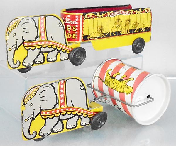 2 COURTLAND CIRCUS TOYS: litho tin, Elephant w/Africann Lion Trailer, 12 in long, Elephant w/Drum, 9 1/2 in long, C7-8.