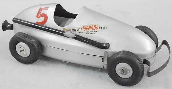 WOODETTE TORNADO RACER: aluminum body, 12 in long, tires worn, air powered racer not working, plastic exhaust pipe broken, decal missing on 1 side, C6-7.