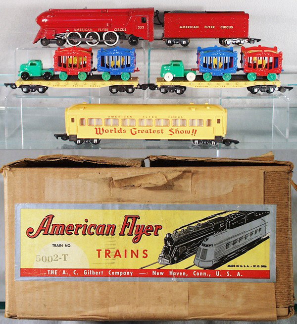 AMERICAN FLYER 5002T CIRCUS SET: S ga, 353 red loco & tender, 2 die cast 643 flat cars, orig loads, yellow baboon, zebra, lion & rhino, rhino car has 1 chipped finial, 649 performer's car, some edge chips on bottom, orig set box mino