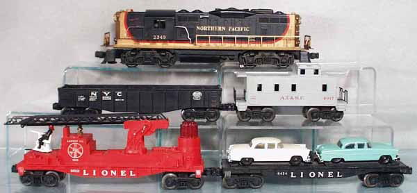 LIONEL TRAIN SET: O ga, 2349NP GP9 diesel, 6062 gondola, 6424 auto car, 3512 fire safety car, main ladder support has 2 broken tips, 6017 caboose, C5-6.