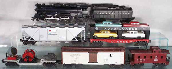 LIONEL TRAIN SET: O ga, 2065 loco, 6026W tender, 6346-56 Alcoa quadhopper, 6414 auto car, 3650 searchlight extention, 3662 milk car, 6357 caboose, C5-6.