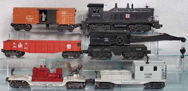 LIONEL TRAIN SET: O ga, 6220 switcher, 3464 operating box car, 2460 crane, 6462 gondola, 6520 searchlight, 6419 work caboose, C5-6.