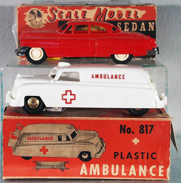 2 WYANDOTTE VEHICLES: plastic, friction working 3100 Cadillac, 8 3/4" long, 817 Ambulance w/stretcher, 9 1/4" long, orig boxes rough, C7-8.