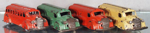 4 WYANDOTTE TRUCKS: painted pressed steel, each 6 3/8" long, Bus, 2 Panel Banks, Gasoline Truck, 2 tires worn, 4 tires replaced, C4-5.