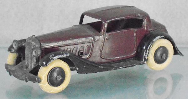 DINKY 24D VOGUE SALOON: brown & black, tires worn, X frame, ca 1934-40, C7.