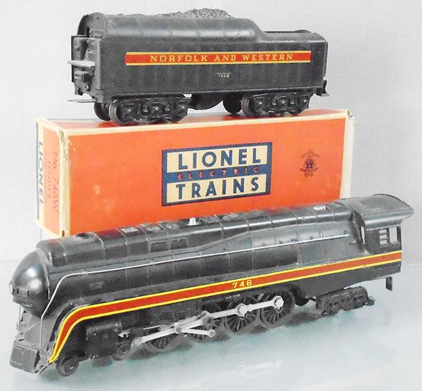 LIONEL 746 N&W LOCO & TENDER: O ga, 746 loco, edge wear to yellow stripe on 1 side, 746W short-stripe tender, both tender trucks missing pick ups, orig tender box only, flaps reattached, C7.
