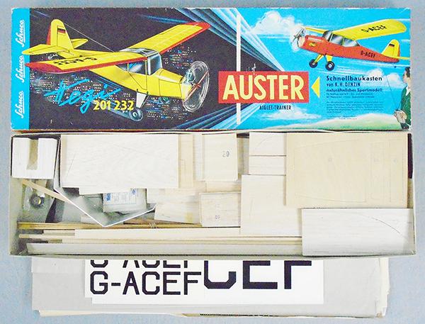 SCHUCO - HEGI 201232 AUSTER AIRPLANE: balsa airplane kit, appears complete & not started, missing 1 wheel, orig box measures 26 1/2 X 8 X 2 1/2, orig box minor wear, 8-9.