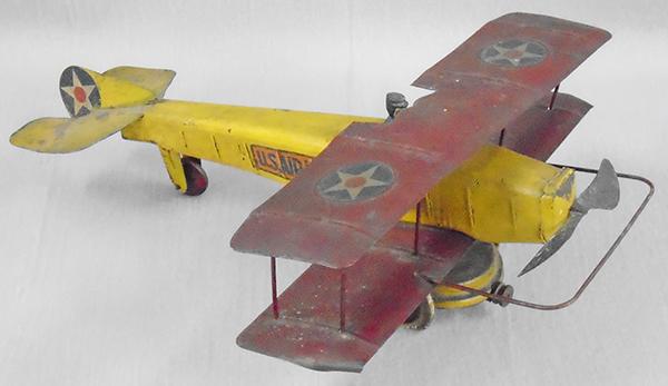 KINGSBURY US AIRMAIL BIPLANE: painted pressed steel, 12 in wingspan, windup working, pilot has chipped arm, missing drive spring for propeller, paint worn, C5.
