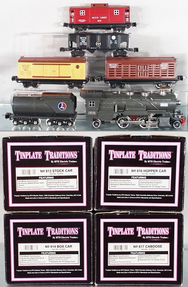 MTH TRAIN SET: O ga, 10-1063-1 260E loco, some chips on boiler, 260 tender, 10-3003 box car, 10-3005 stock car, 10-3007 hopper, 10-3004 caboose, orig car boxes only, C7-9.