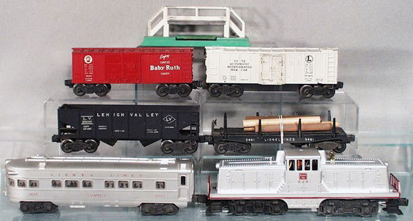 LIONEL TRAIN SET: O ga, 629 Burlington diesel loco, 3461 log dump, 2456 hopper, 3472 milk car w/platform, small chip on base, 6014 box car, 2436 Summit obsv, C5.