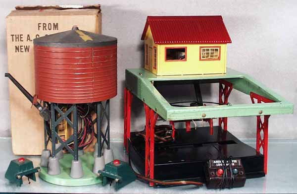 2 AMERICAN FLYER ACCESSORIES: S ga, 596 water tower, orig box worn, 2 #730 bumpers, 751 log loader, missing 2 window inserts, w/button, C5-6.