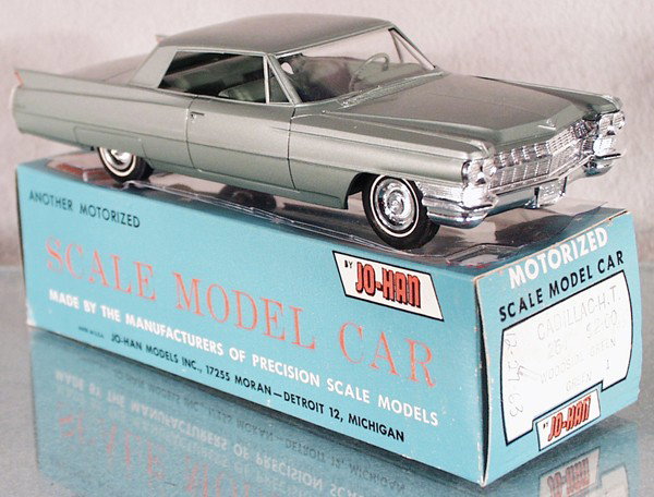 JO-HAN 1964 CADILLAC COUPE DEVILLE PROMO: plastic, green w/interior, friction working, orig box & cellophane window minor wear, C8.