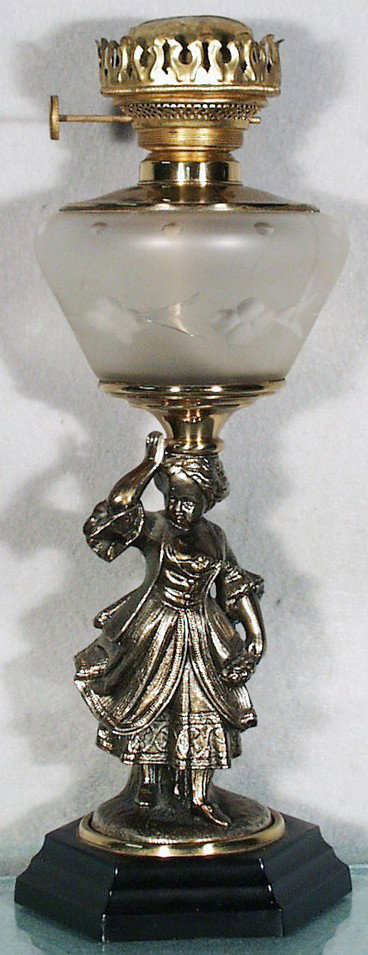 WOMAN W/FLOWERS OIL LAMP: zinc figure w/cast iron base, restored, w/molded cut & frosted font in quatrefoil pattern, 15 1/2" tall, C8.