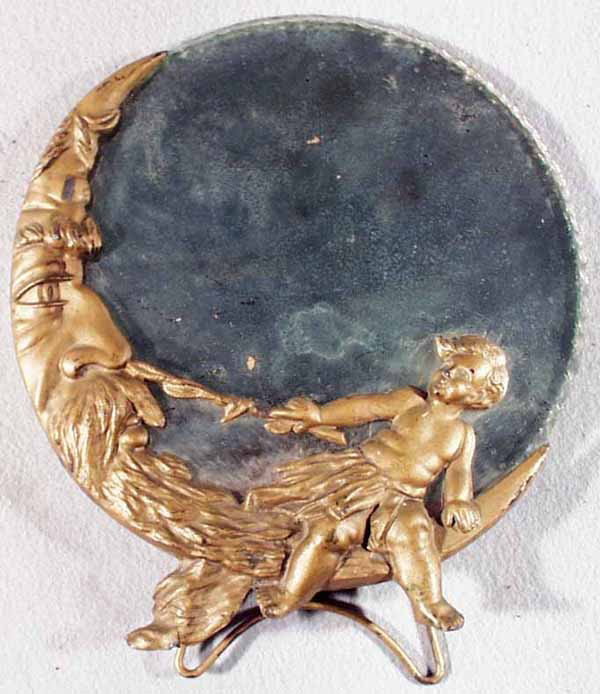 MOON MIRROR: glass & die cast, mirror worn, 9" diameter, C6.