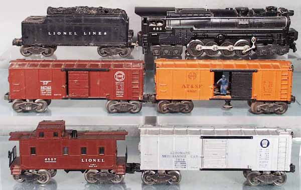 LIONEL TRAIN SET: O ga, 682 turbine loco, minor touch up on white stripe & 1 number, 2466WX tender, 6454 box car, 3464 operating box car, 3454 merchandise car w/3 cubes, 6557 smoking caboose, missing chimney top, C5-6.