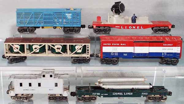 6 LIONEL FREIGHT CARS: O ga, 3386 Bronx Zoo car, 6822 night crew searchlight, 6475 pickle car, w/paper labels, 6428 post office box car, 6017 caboose, 3362 helium tank car, C4-6.