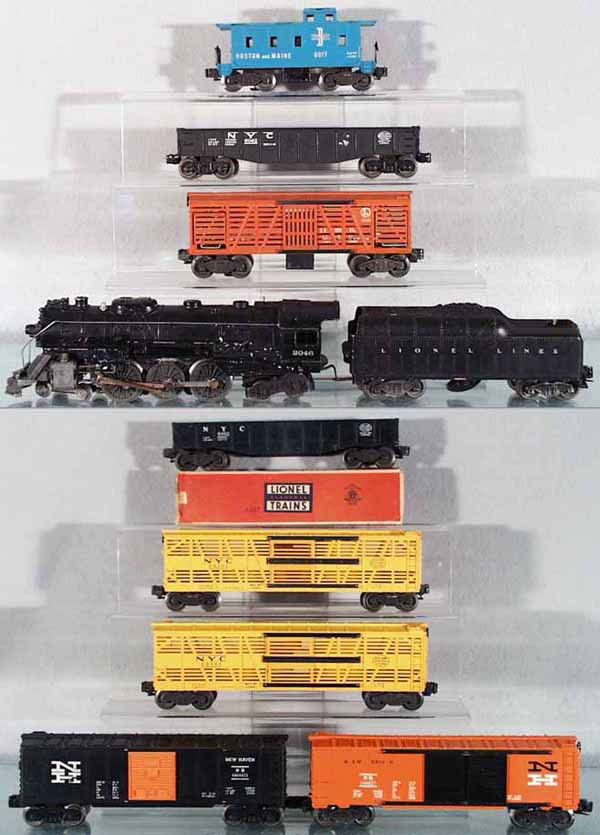 LIONEL TRAIN SET: O ga, 2046 loco, missing headlight jewel, 2046W tender, 1 step broken, 3656 stock car, 6062 gondola, 6462 gondola, w/incom & worn orig box, 2 #6356 stock cars, 6464-425 NH box car, 6468-25 NH box car,