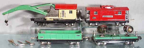 4 LIONEL FREIGHT CARS: O ga, 812 gondola, w/3 tools, 820 searchlight, 2810 crane, control knobs are lead replacements, 817 caboose, 4 couplers incom, C5-6.