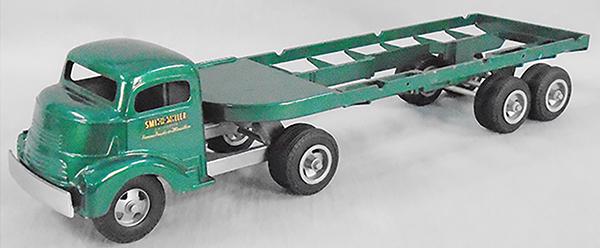 SMITH MILLER 406L GMC LUMBER TRUCK: die cast, green, 23 in long, missing lumber & 3 rollers, ca 1949, professionally restored, C9.