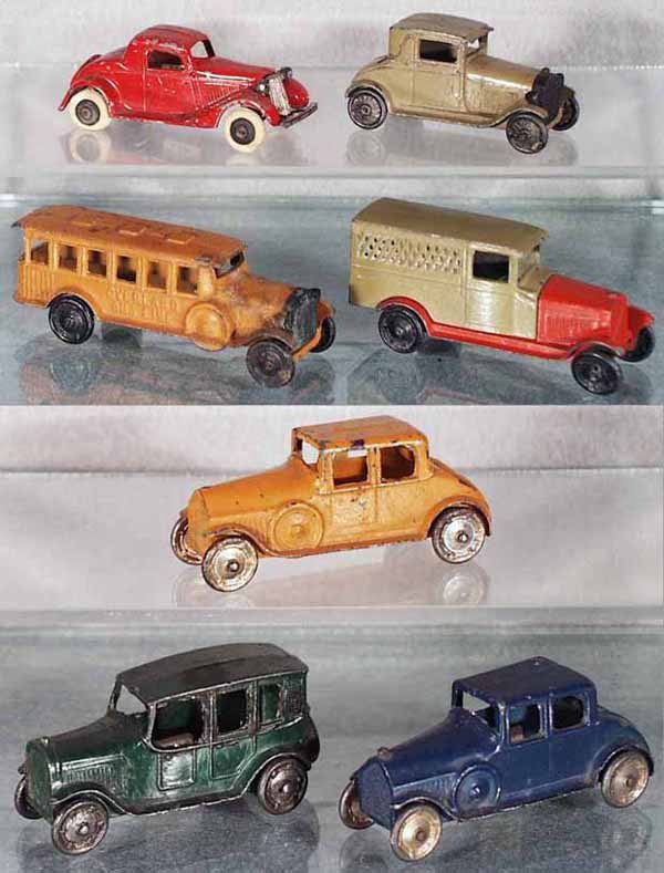 7 TOOTSIETOY VEHICLES: 112 Ford Coupe, 4655 Model A, 4680 Overland Bus, 6306 Oldsmobile Van, 2 #4636 Sedans, 4629 Cab, C4-5.