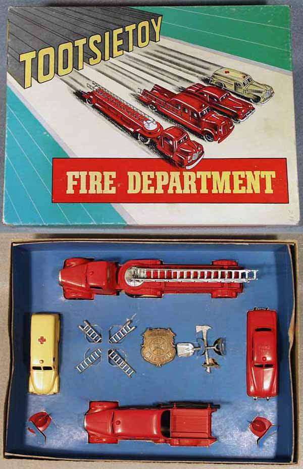 TOOTSIETOY 5211 FIRE DEPARTMENT SET: contains Mack Ladder Truck, Mercury Fire Chief Car, GMC Ambulance, Mack Patrol, w/ladders, helmets, badge & tools, orig box & insert minor wear, C9.