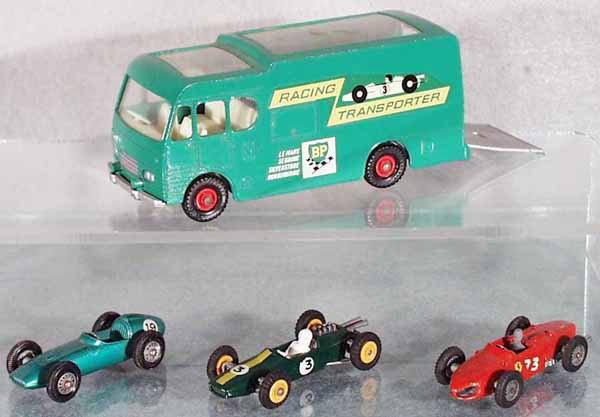 4 MATCHBOX VEHICLES: K5B1 Car Transporter, 19C4 Aston Martin, missing driver, 19D4 Lotus, 73B1 Ferrari, some rubber tires worn, C4-5.