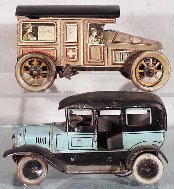 2 LITHO TIN AUTOS: Strauss Ambulance, roof repaired, 6" long, Bing Sedan, missing door, clockwork working, 6" long, C4-5.